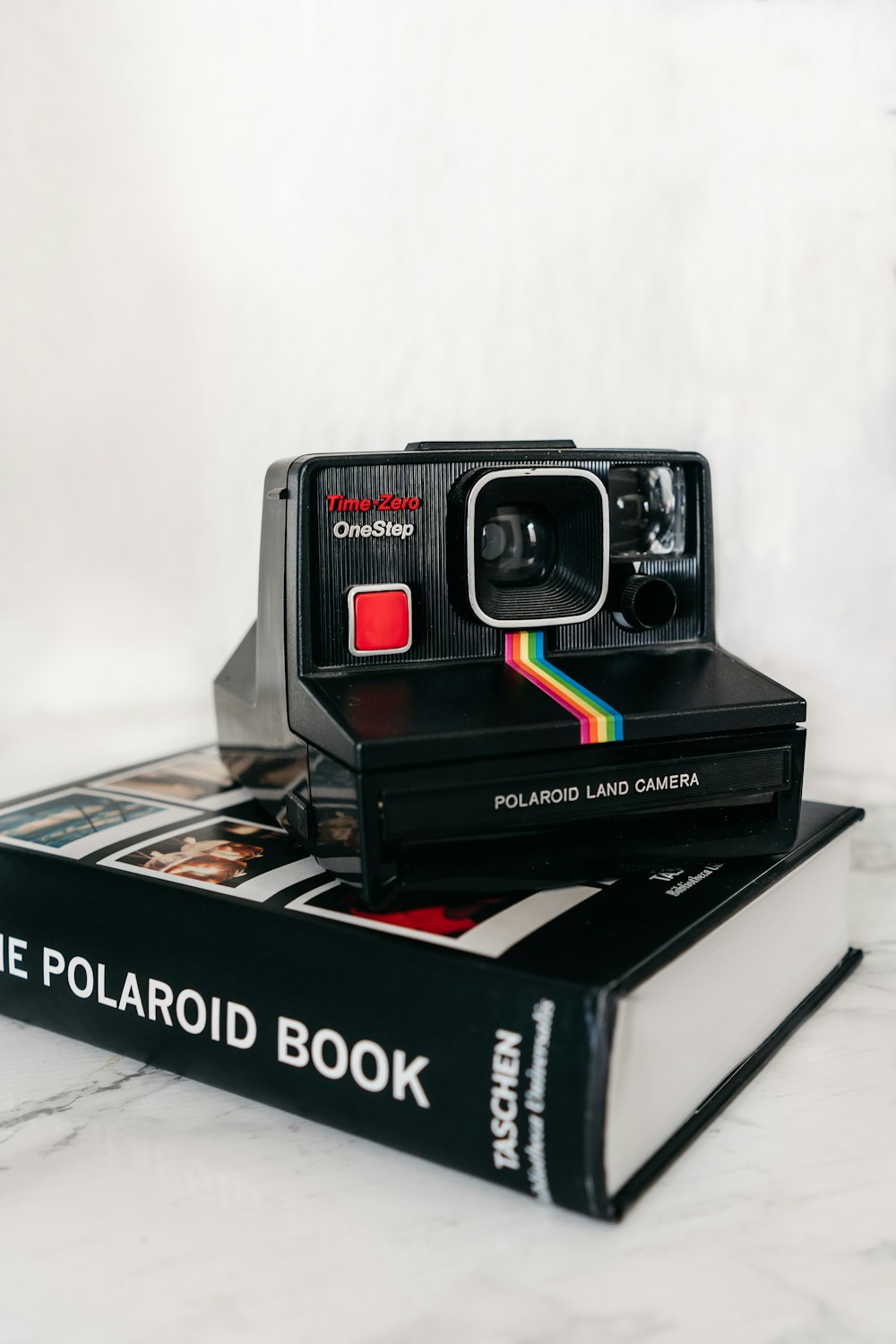 red and black polaroid camera