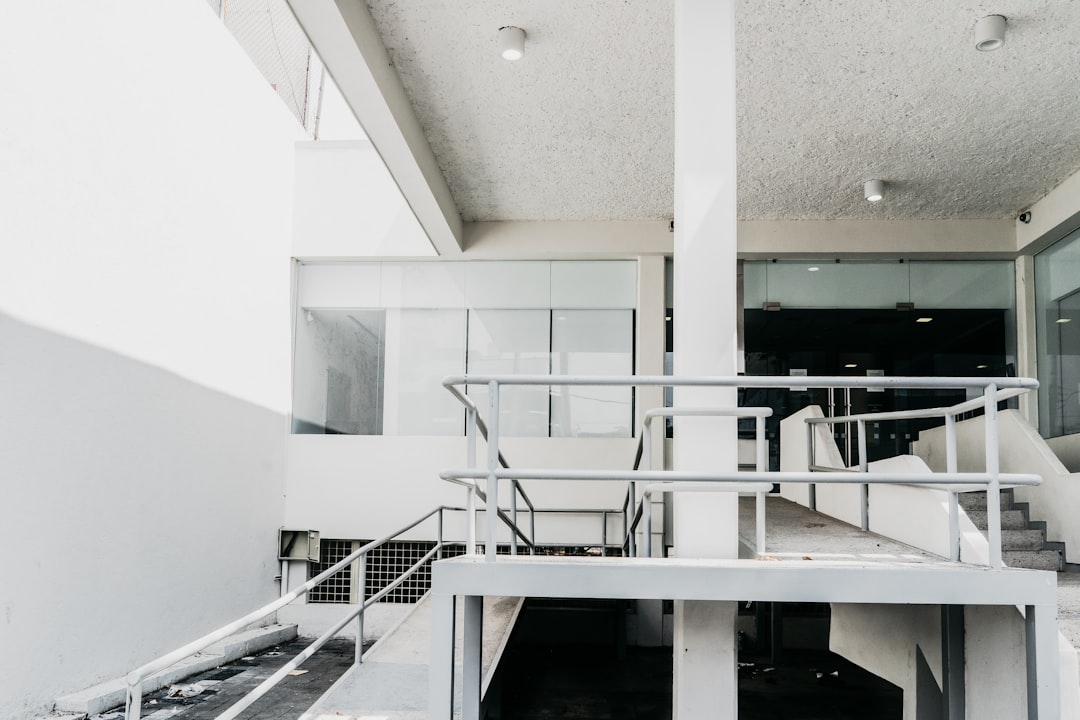 white concrete building with staircase,