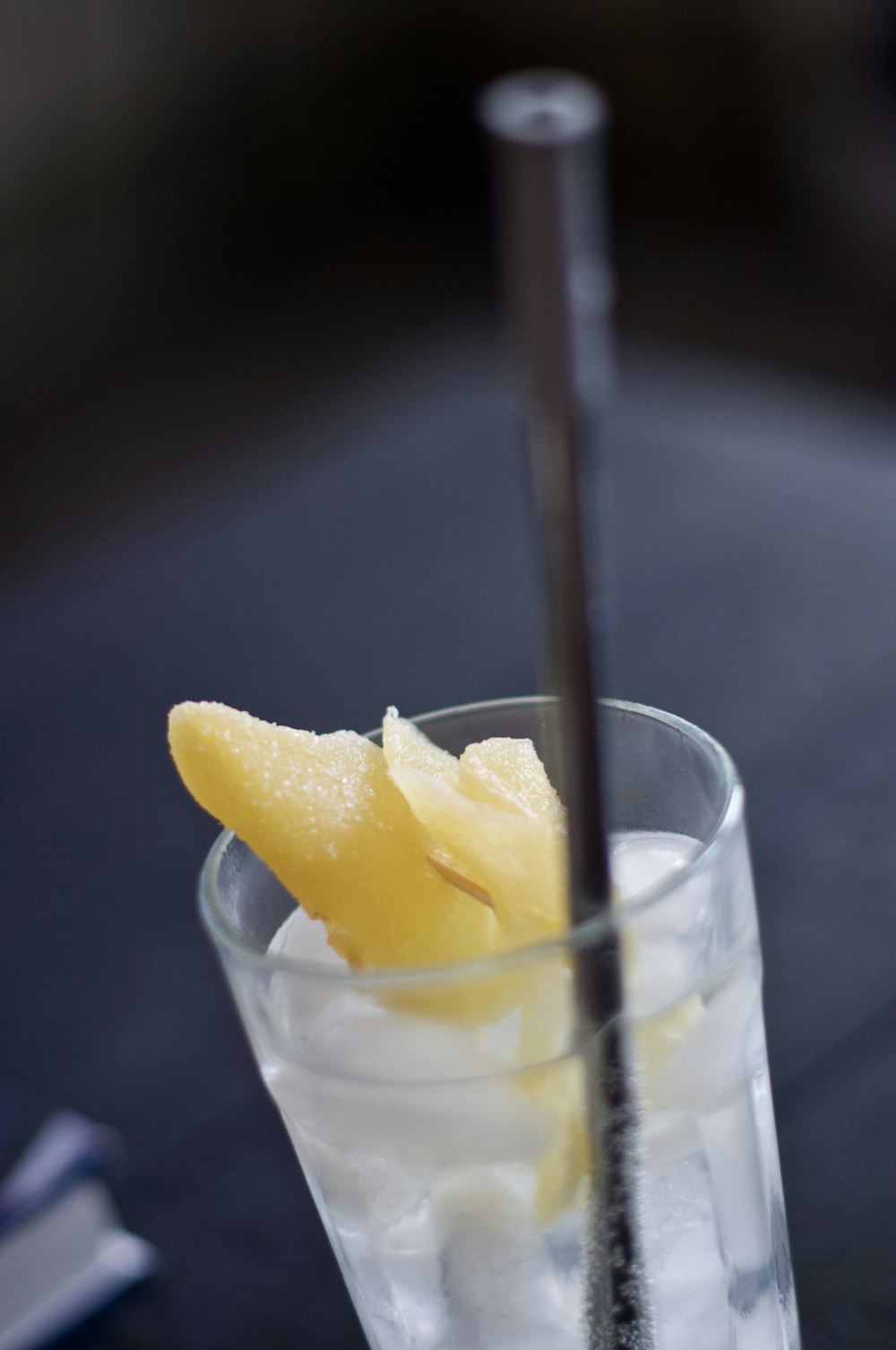 yellow sliced fruit in clear drinking glass