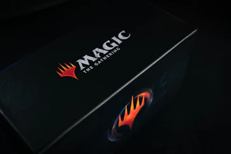 Close-up of the iconic Black Lotus card glowing with magical energy.
