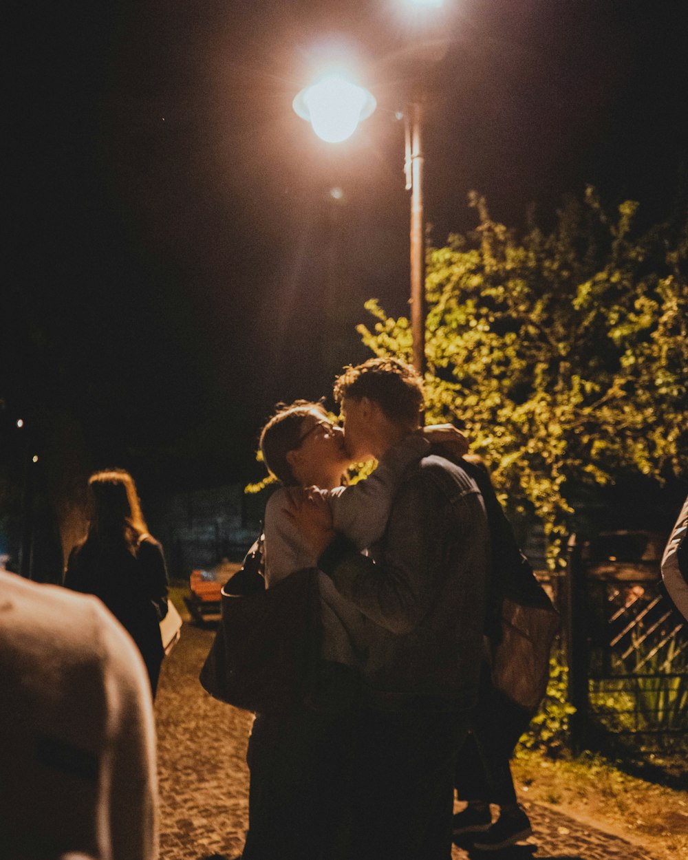 people sitting on bench during night time