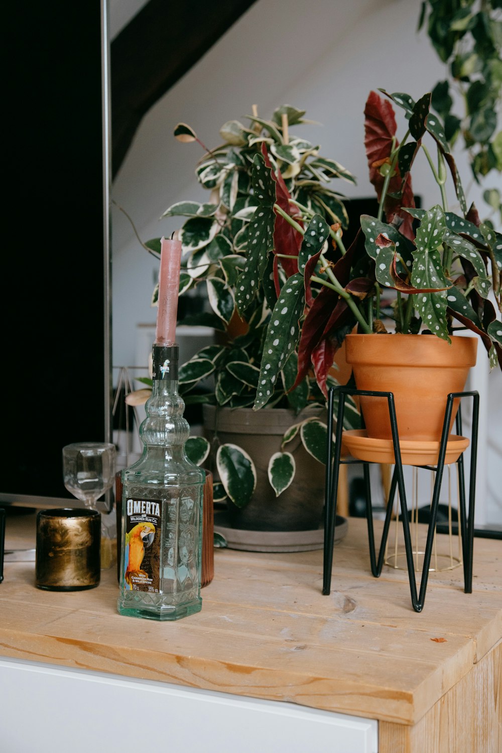 clear glass bottle on brown wooden table