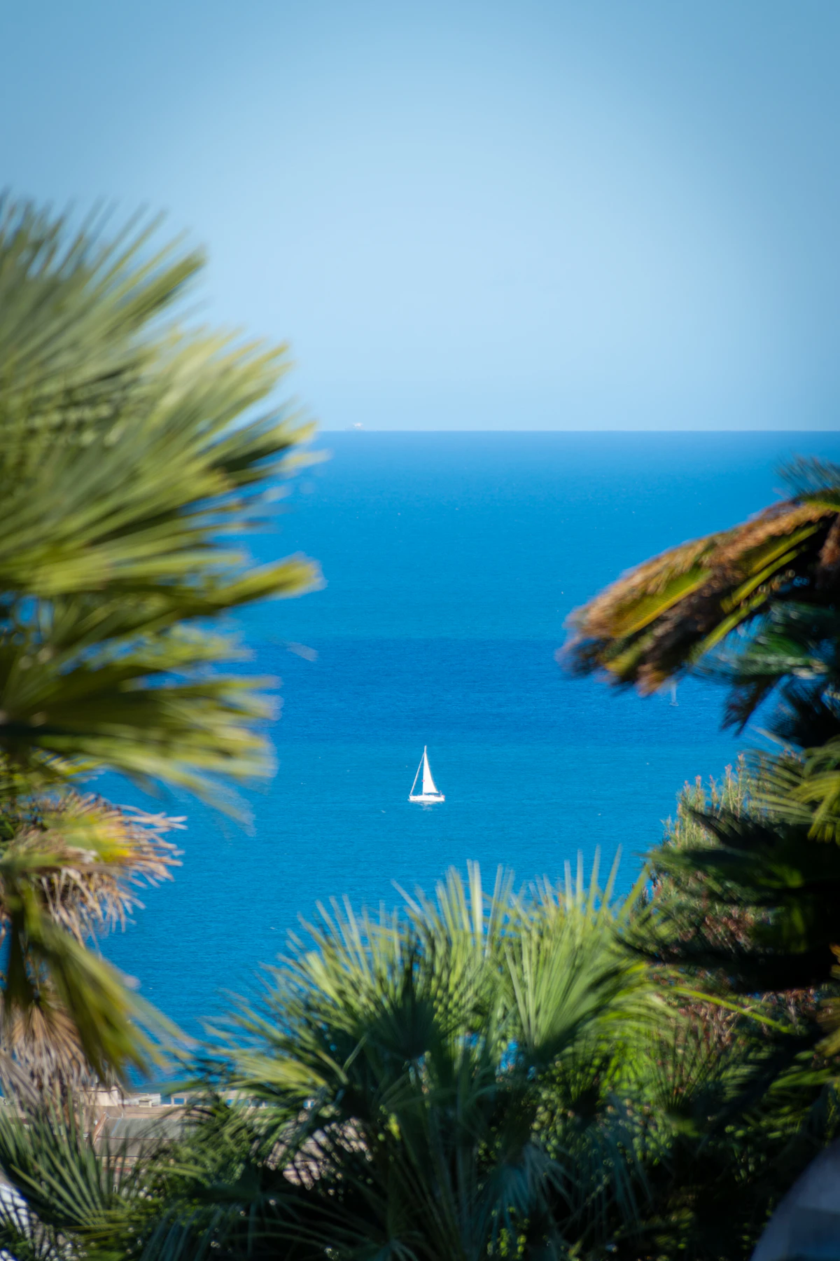 A sailing yacht under way on calm Mediterranean water