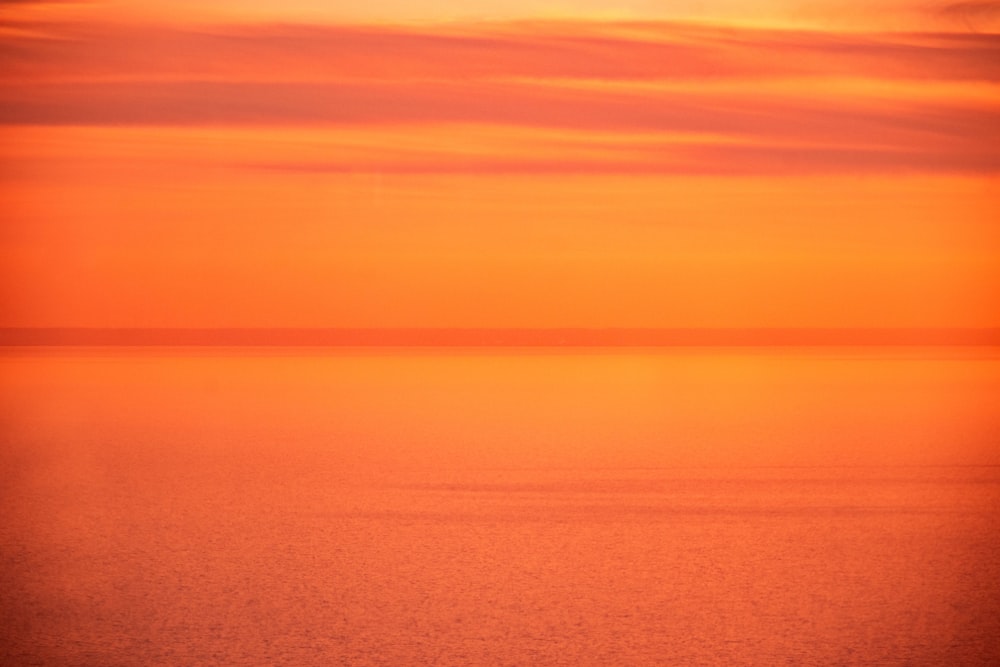 body of water during sunset