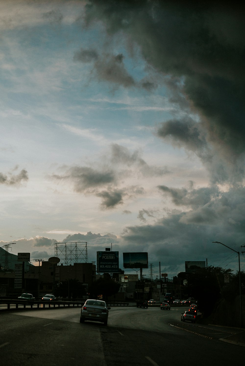 white clouds over city buildings during daytime