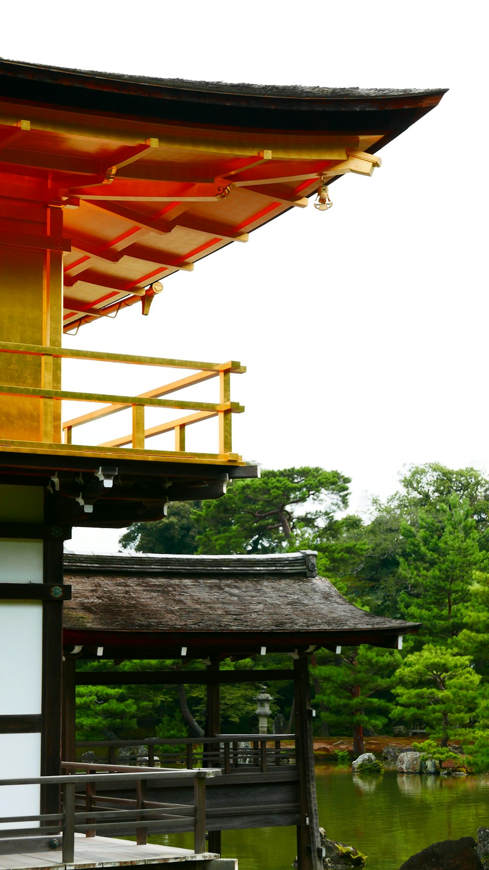 red and white wooden house near green trees during daytime