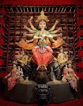 hindu deity statue on brown wooden table