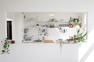 After photo of the same kitchen, now clean, bright, and perfectly arranged with practical organizers.