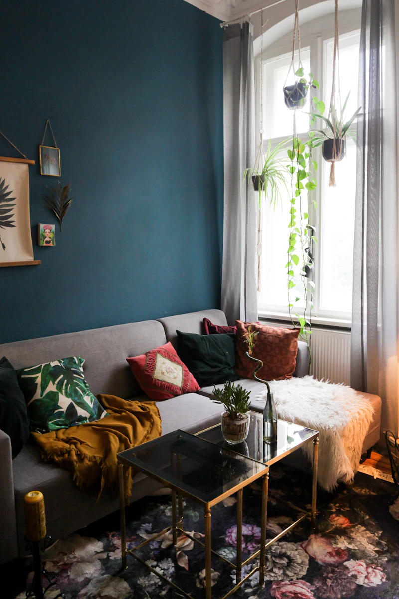 Brass and glass coffee table in a moody room