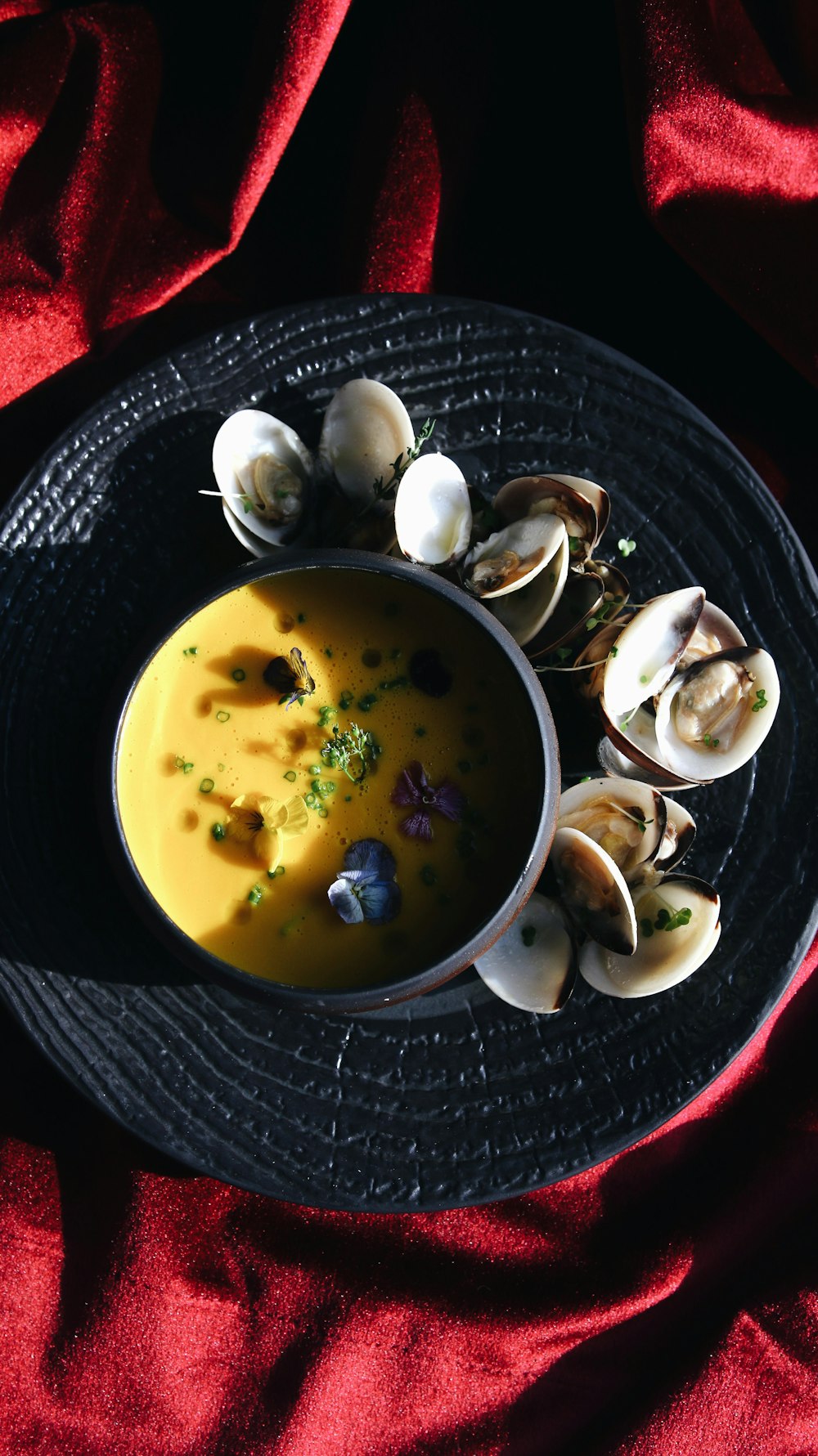 white and black ceramic bowl with soup