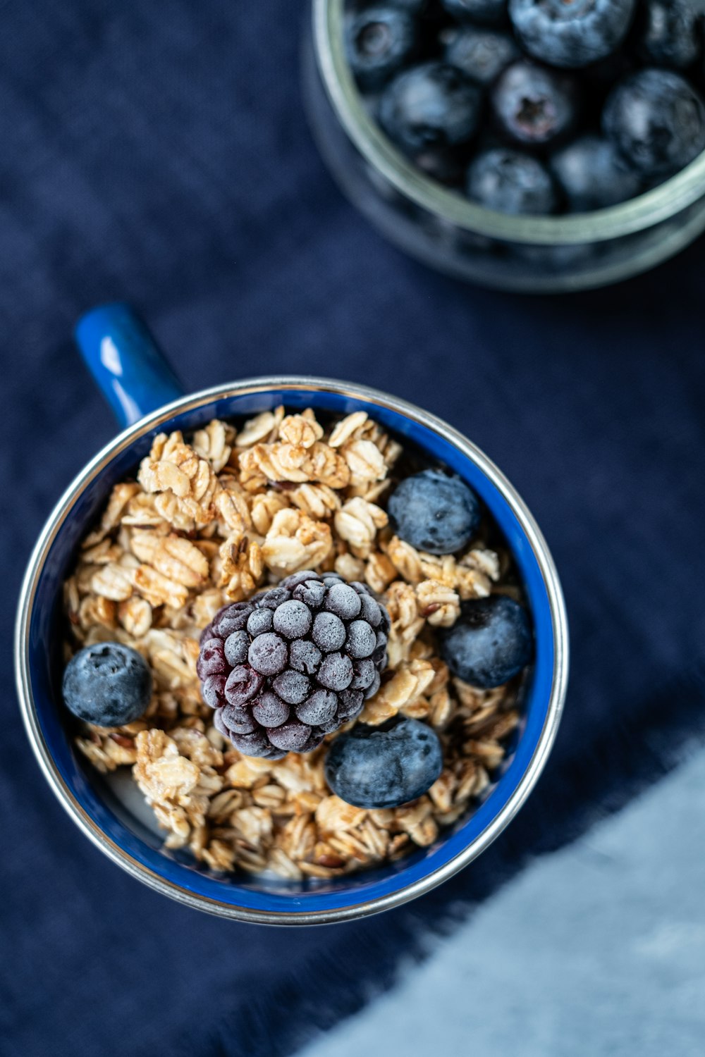 blue ceramic bowl with brown peanuts