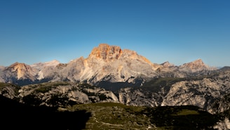 A breathtaking mountain landscape under a clear sky.