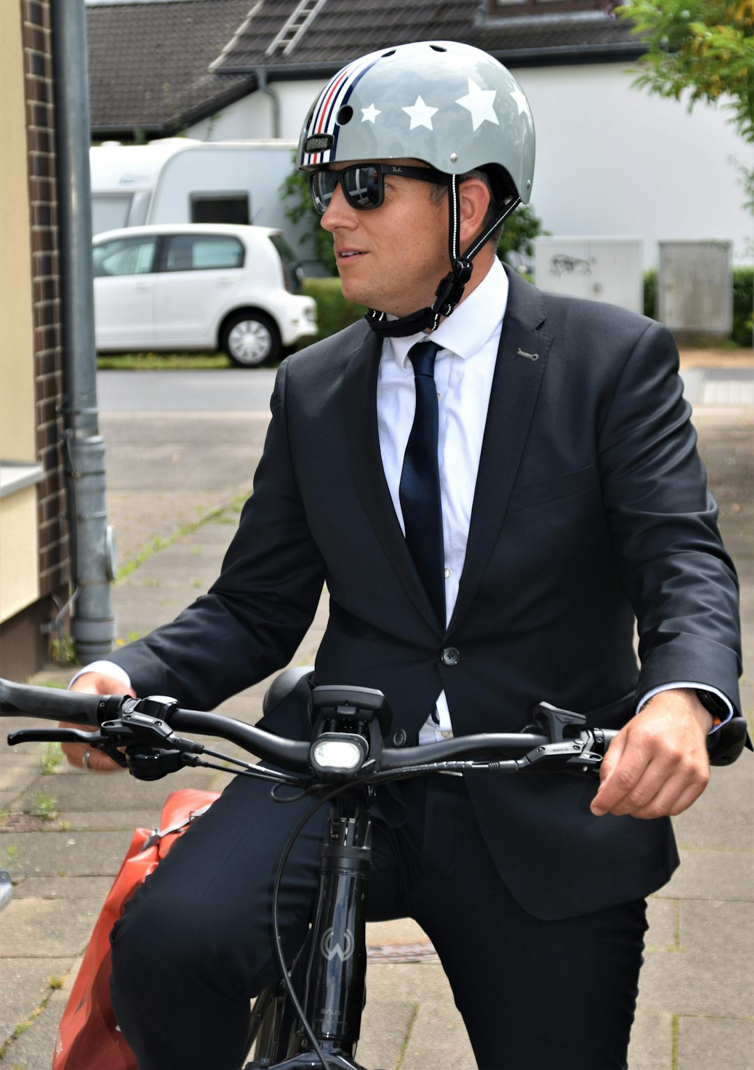 man in black suit riding on motorcycle