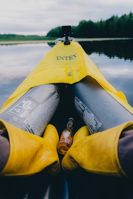 An influencer enjoying a serene lakeside moment with a branded kayak.