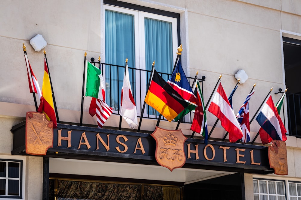 flags on brown wooden signage