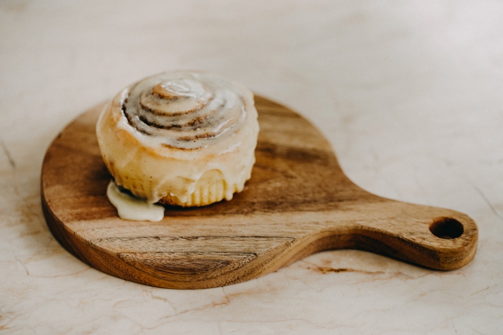 white and brown pastry on brown wooden spoon