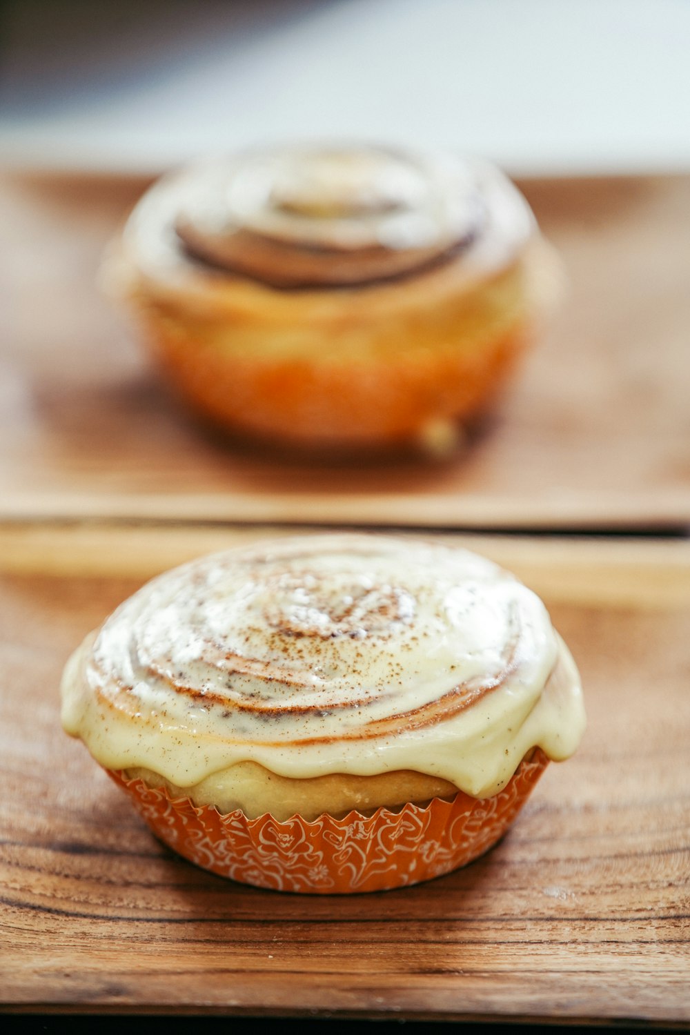 brown and white cupcake on brown wooden table