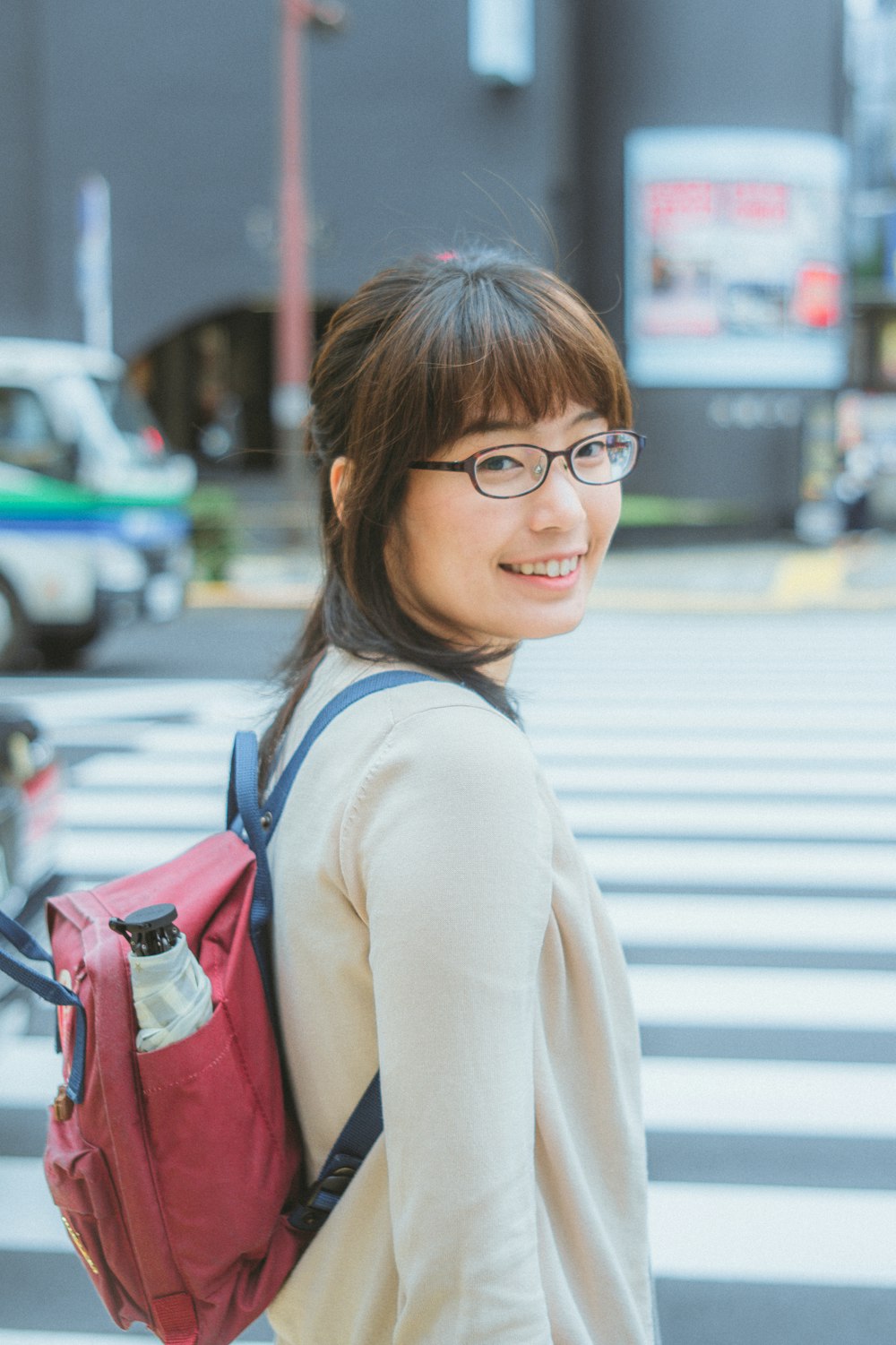 woman in white long sleeve shirt wearing black framed eyeglasses