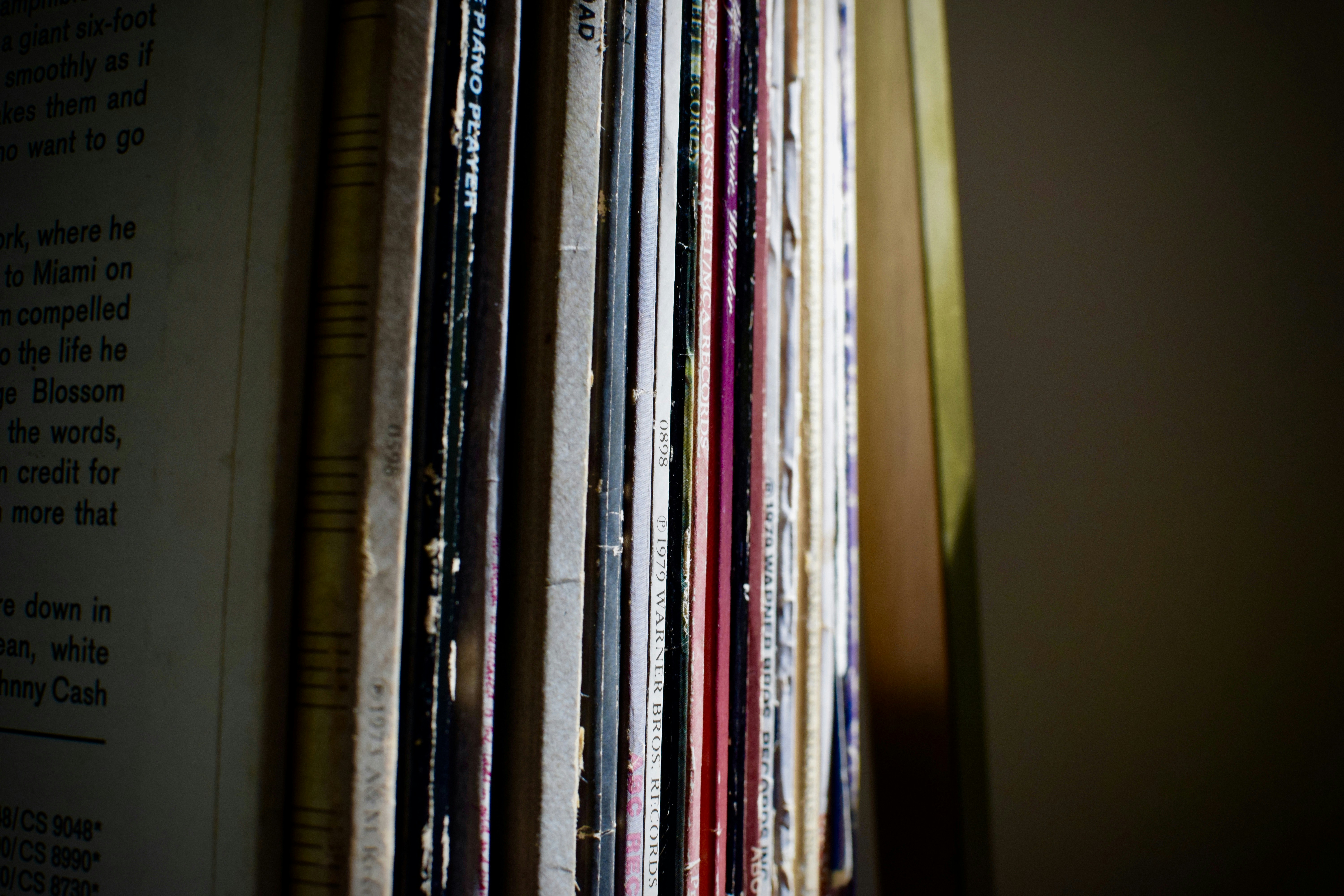 books on brown wooden shelf