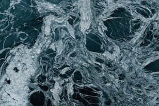 Close-up of polished marble and granite slabs stacked in a warehouse.