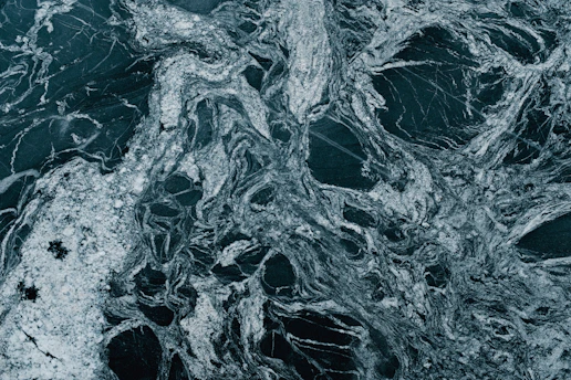 Close-up of a polished marble slab showcasing natural veining and textures.