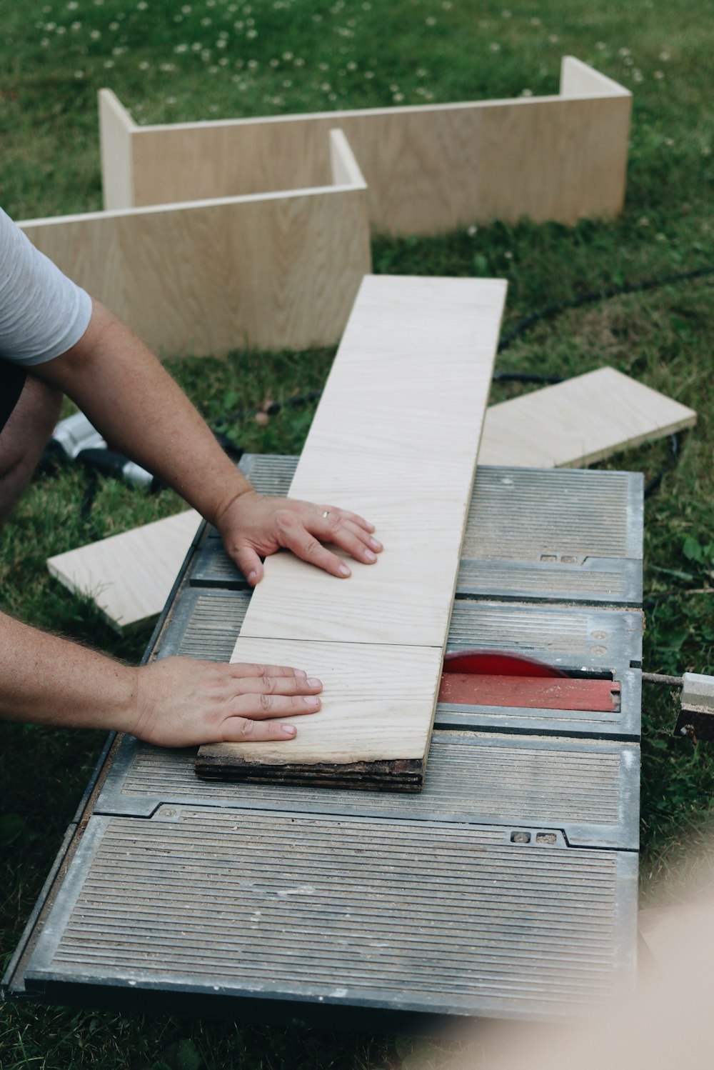 person holding white wooden board