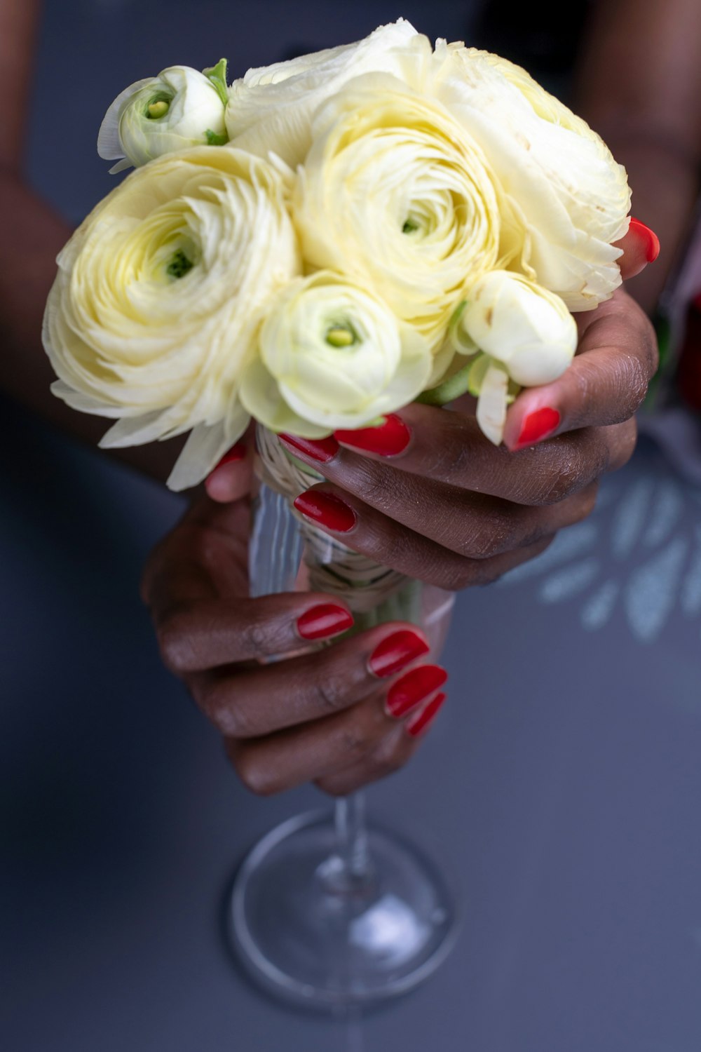 person holding white rose in close up photography