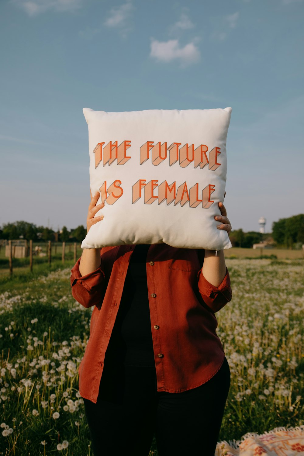 person holding white happy birthday throw pillow