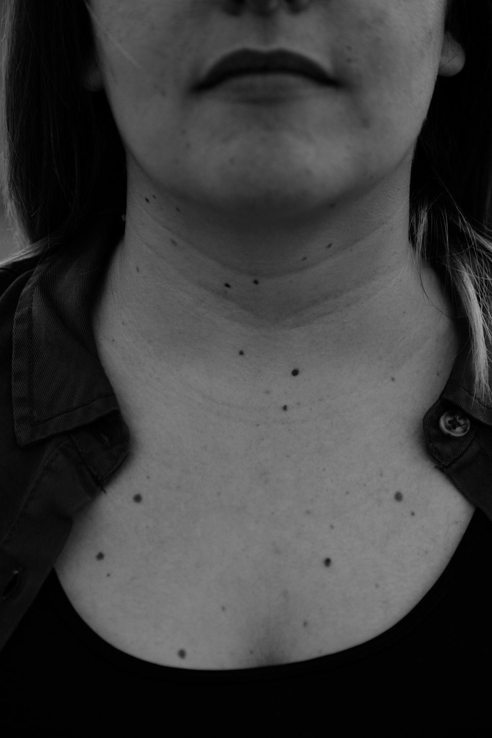 grayscale photo of woman in collared shirt