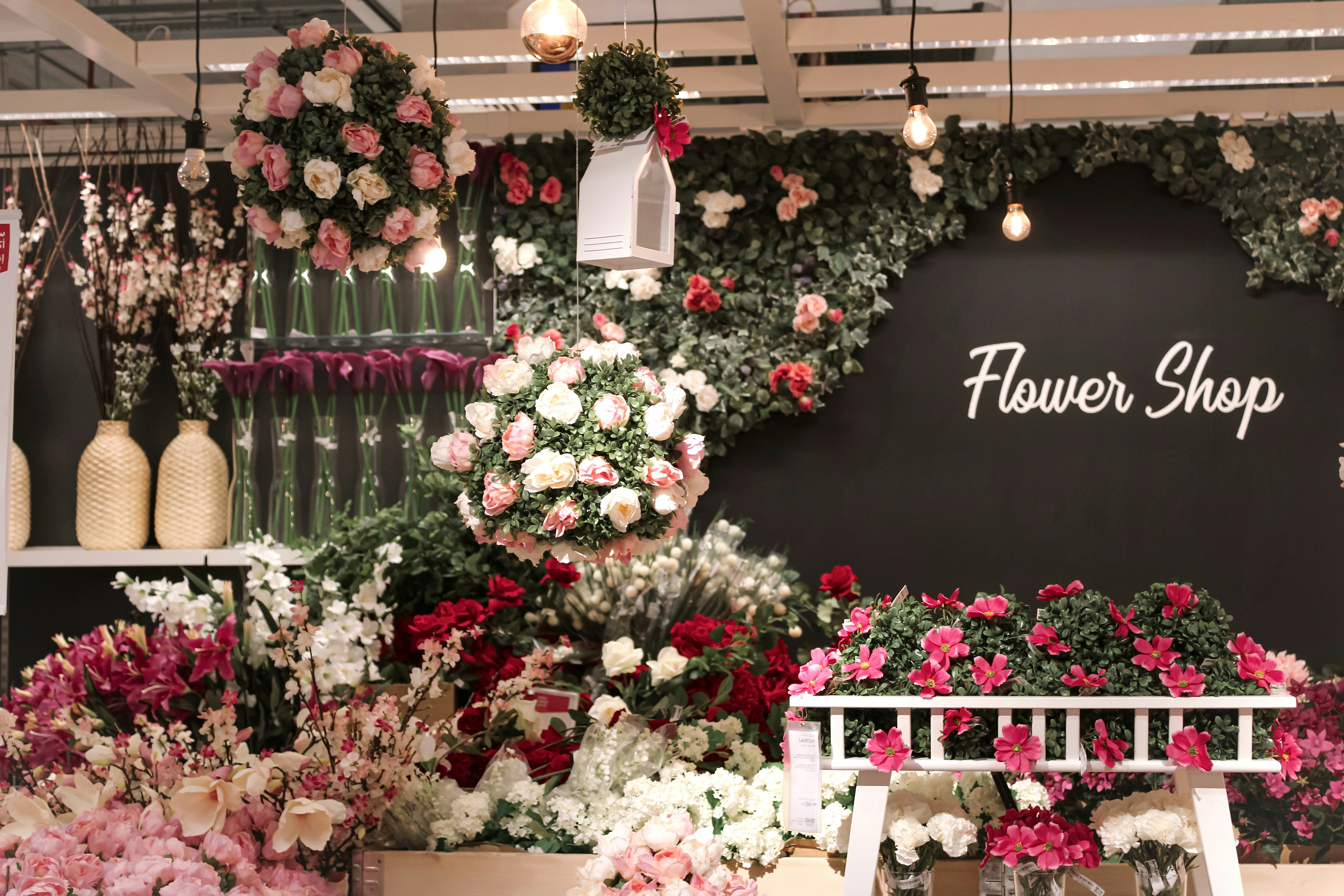 red and white flowers on white wooden table