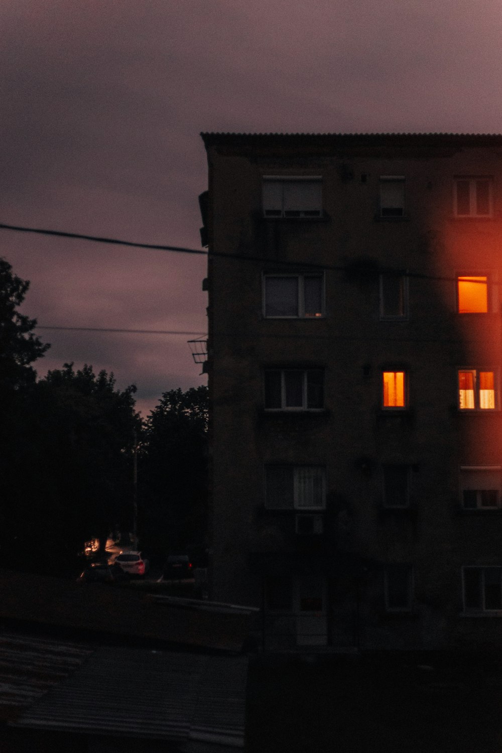 cars parked in front of building during night time