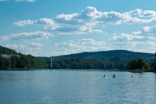 people riding on boat on lake during daytime in Jyväskylä Finland