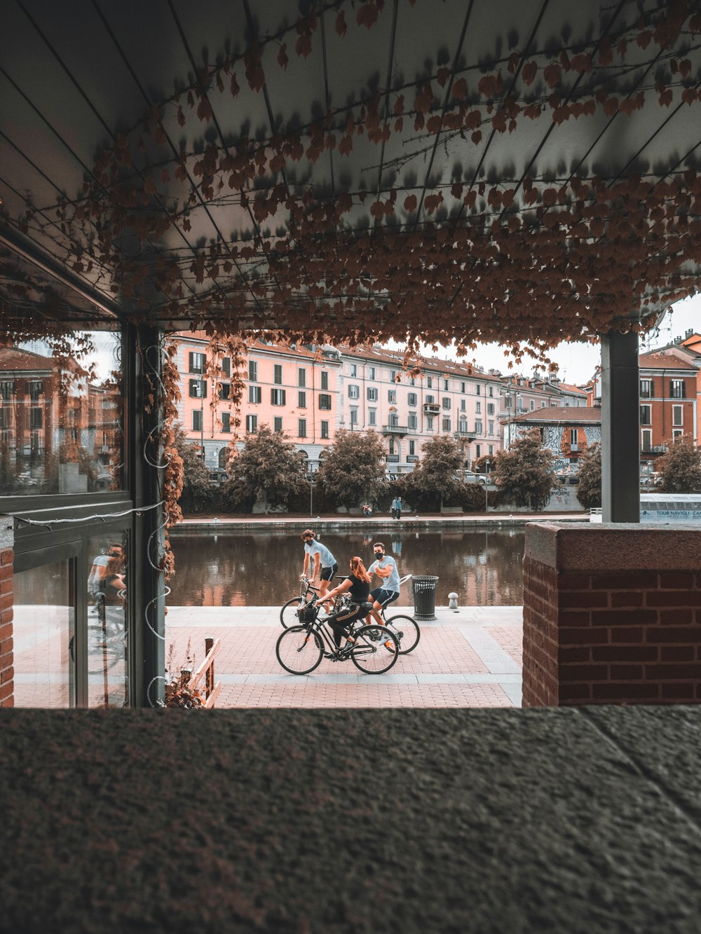 man in black jacket riding bicycle during daytime