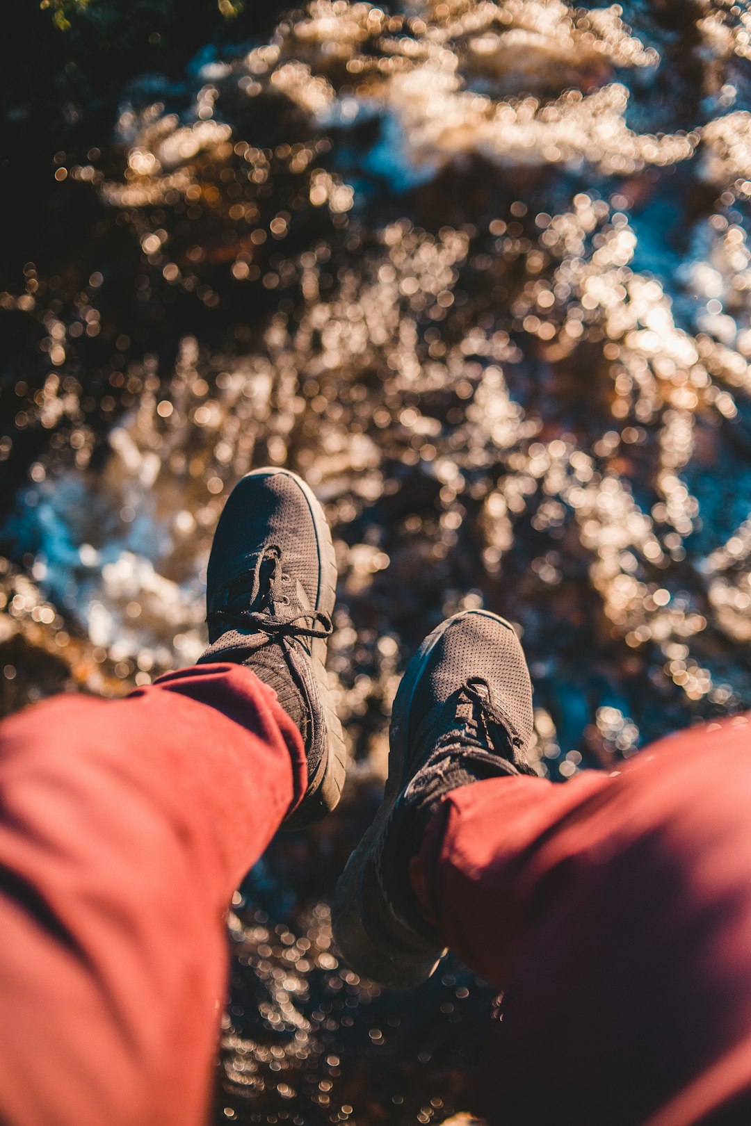 person in brown pants and gray shoes