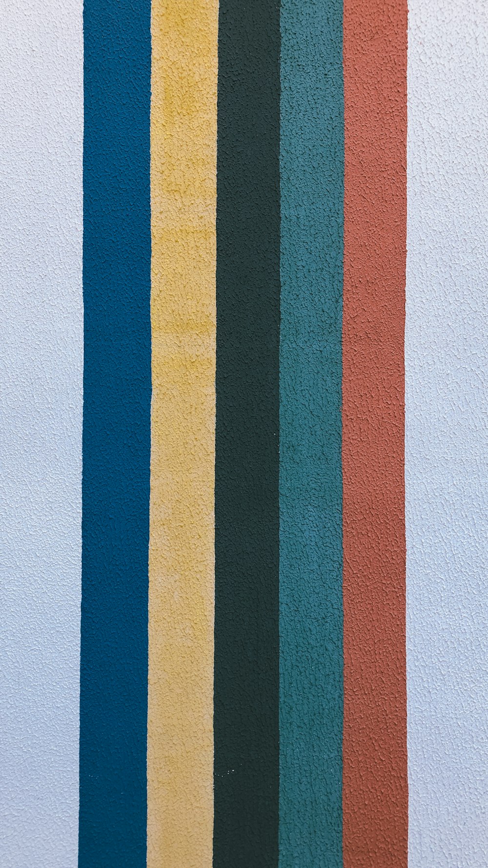 blue yellow and red striped wall decor