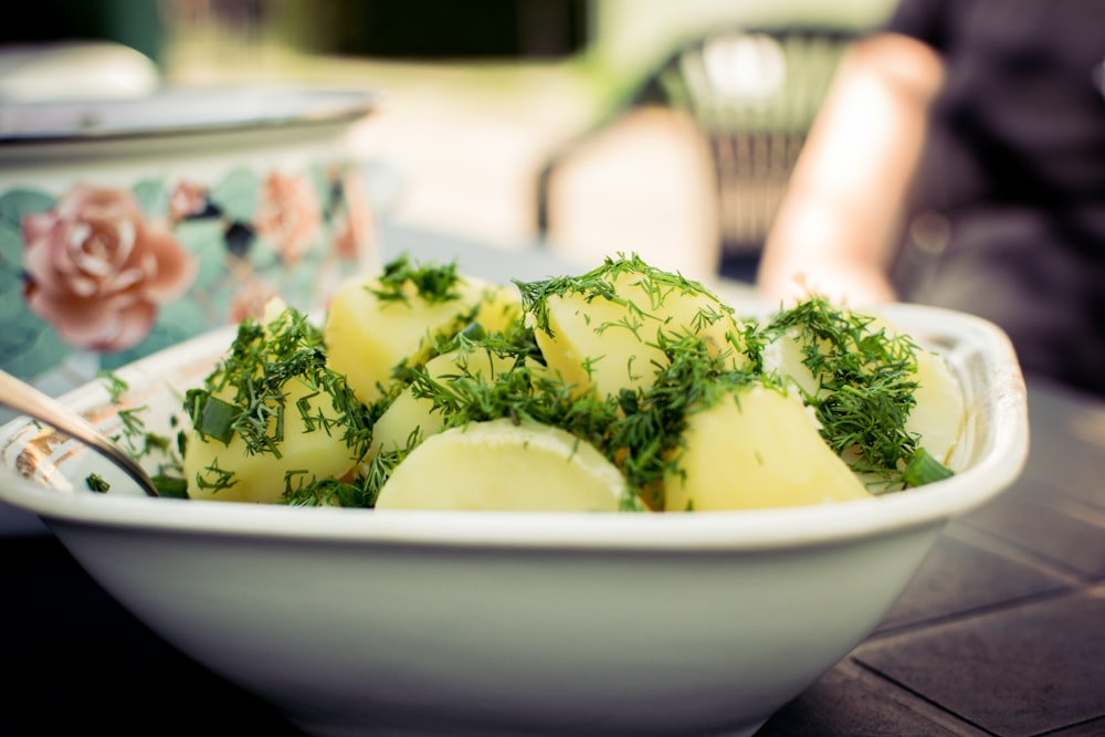 sliced cucumber on white ceramic bowl