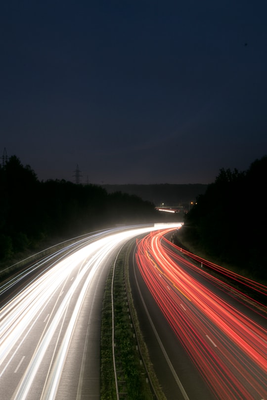 time lapse photography of cars on road during night time in Kaunas Lithuania