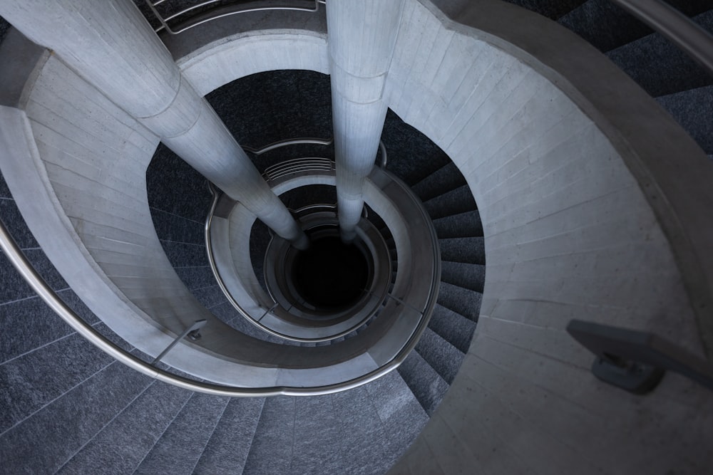 white spiral staircase with black metal railings