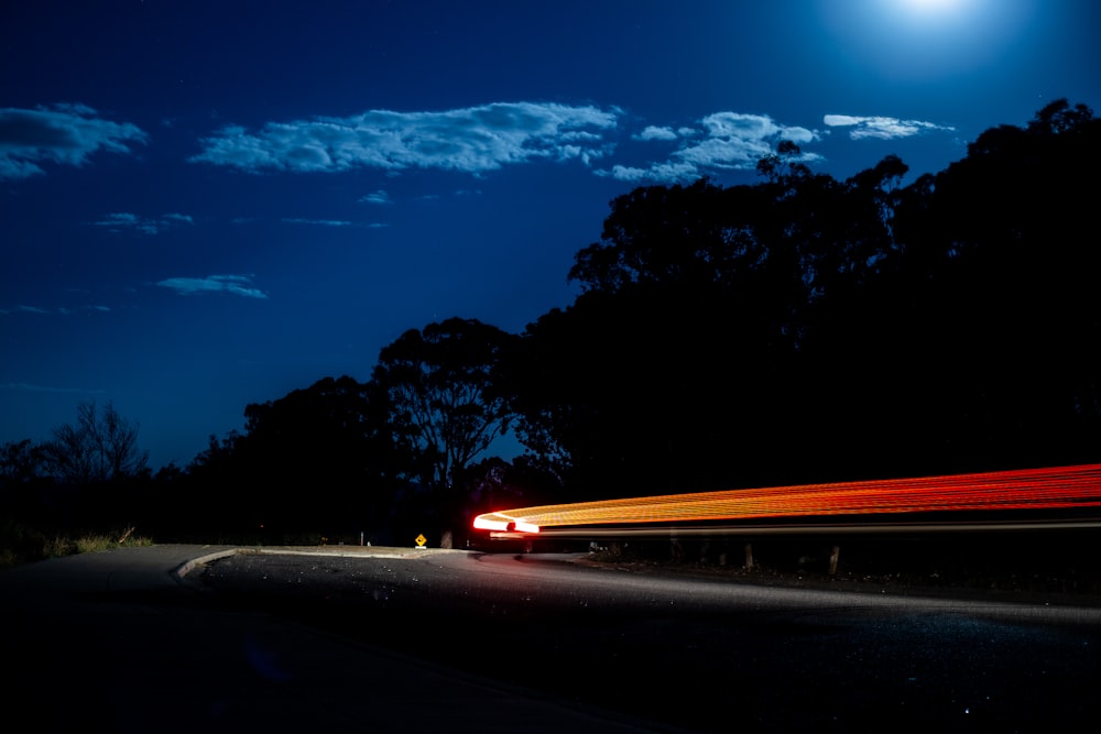 time lapse photography of cars on road during night time