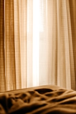 white window curtain near white window curtain