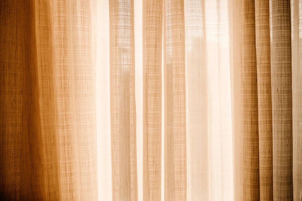 white and brown window curtain