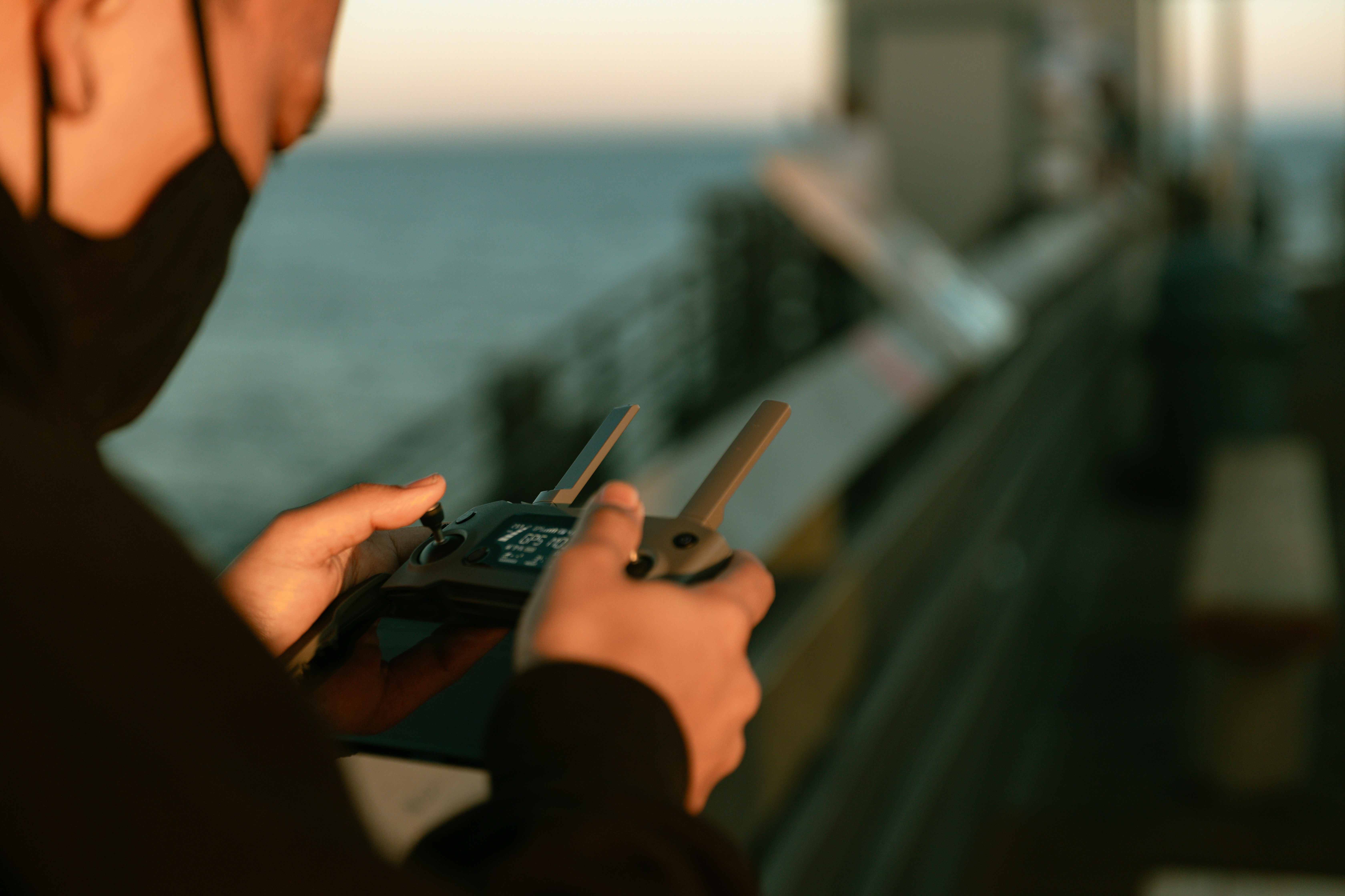 person holding black game controller