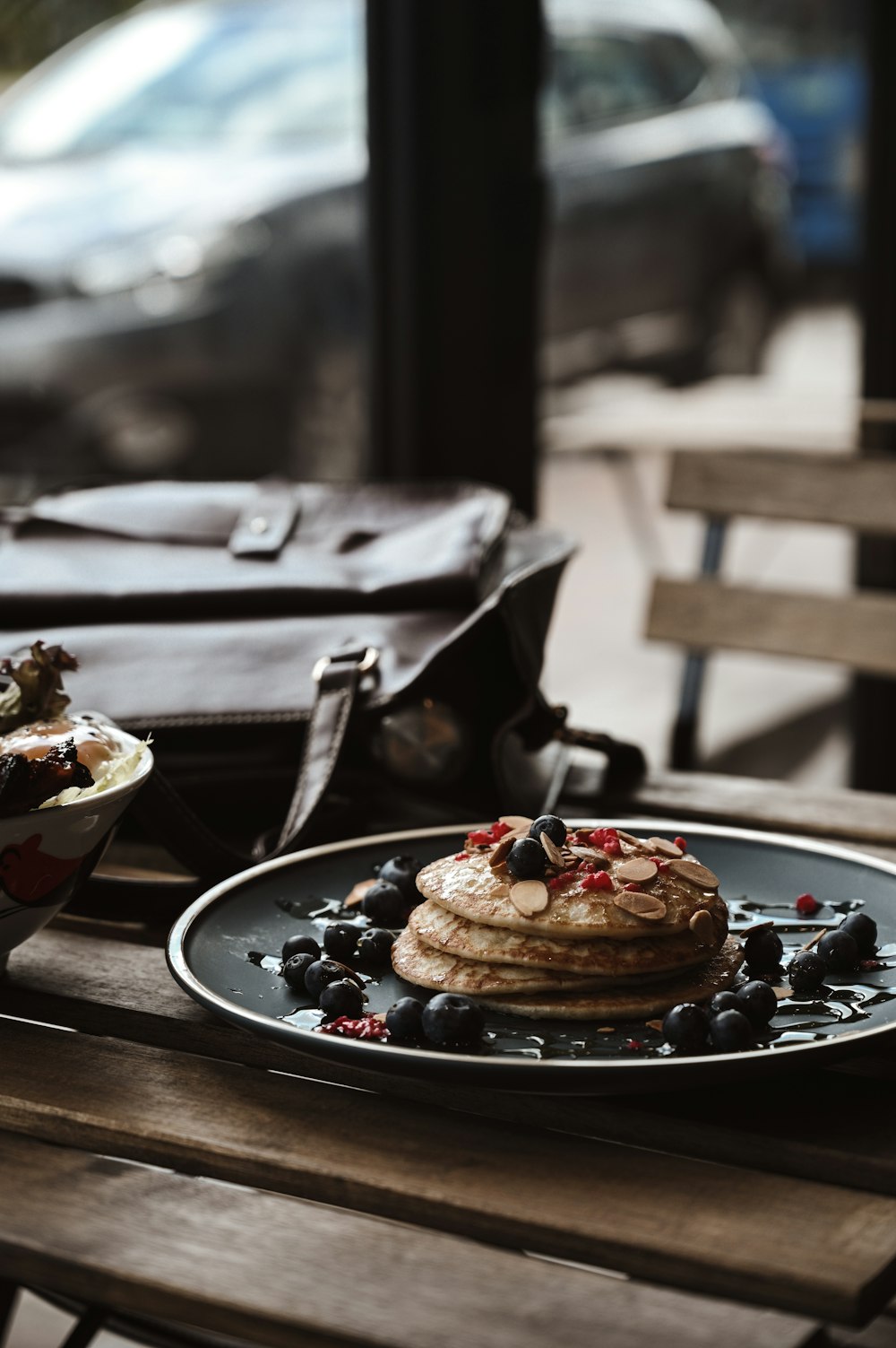 brown and black pastry on black ceramic plate