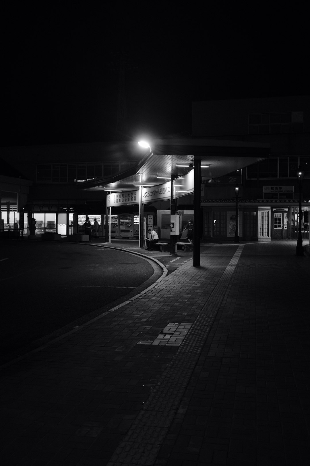 grayscale photo of street during night time