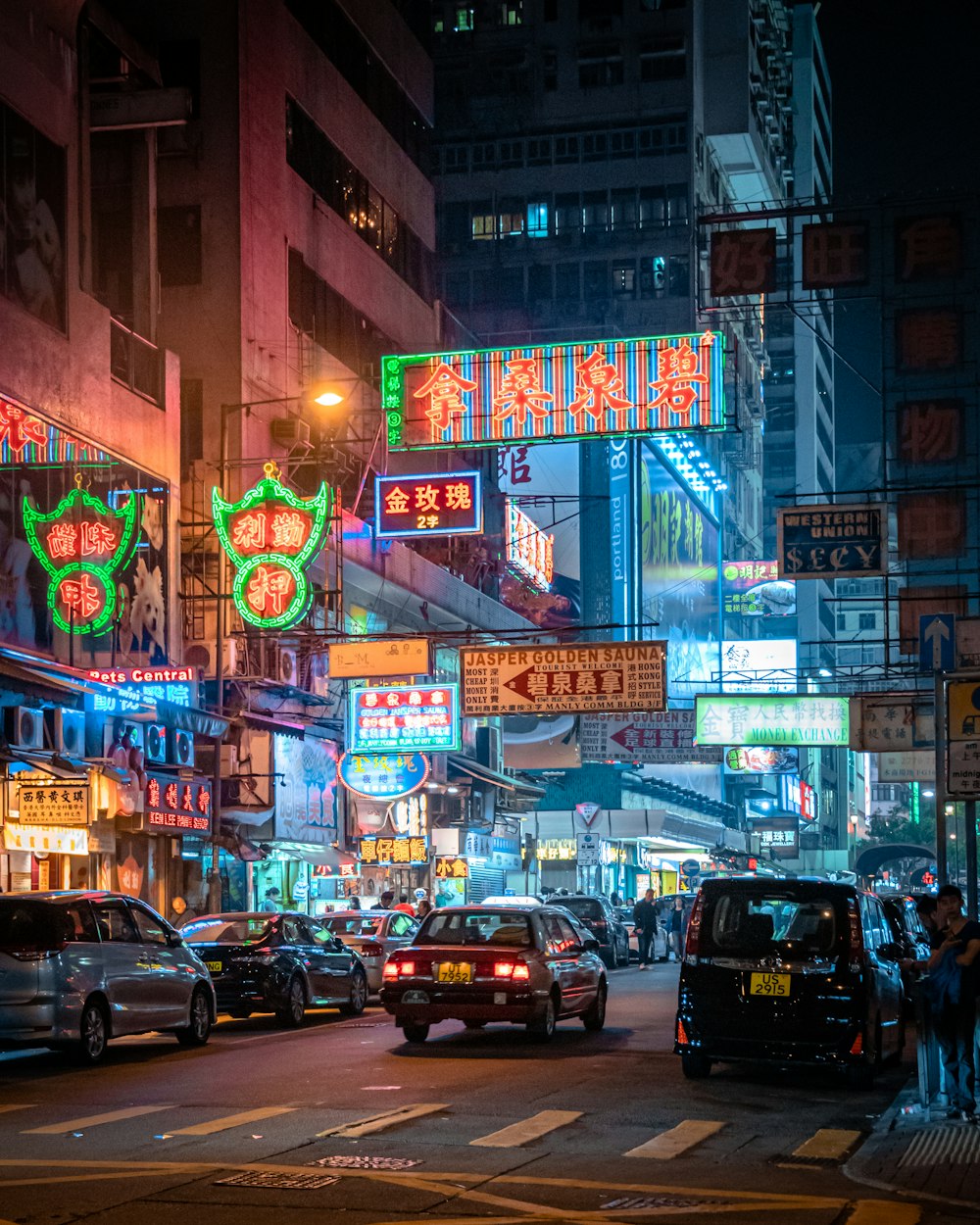 cars parked on side of the road during night time