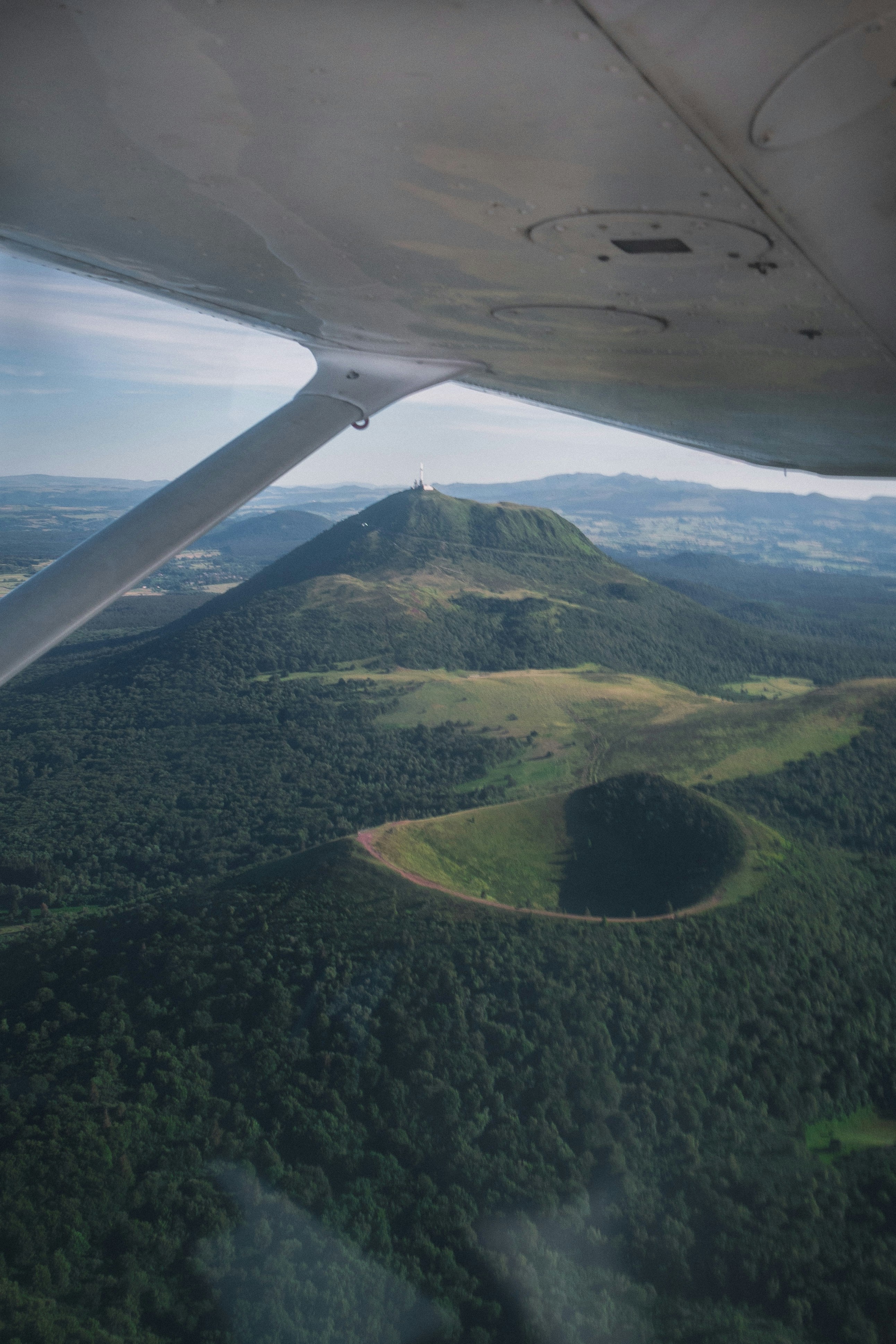 green and brown mountains during daytimeby Nicolas Peyrol