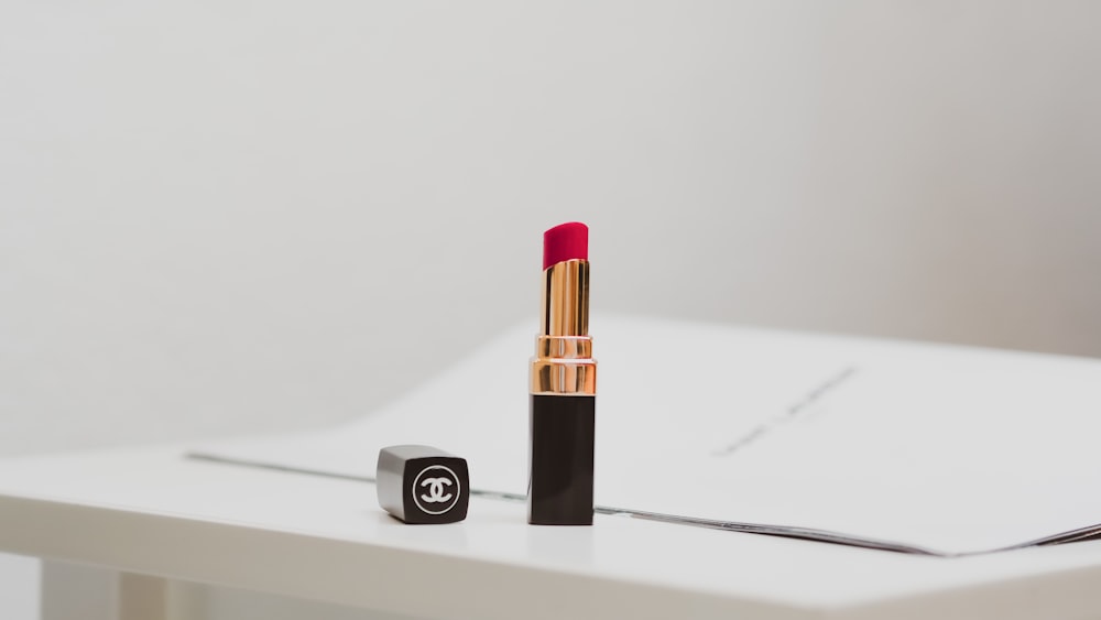 pink lipstick on white table