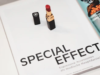 black and red lipstick on white surface