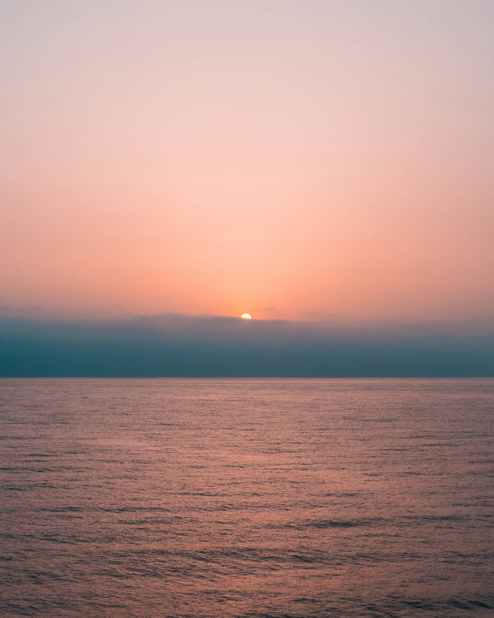 body of water during sunset