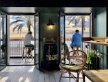 The bar’s exterior with a view of the nearby sea and a welcoming entrance.